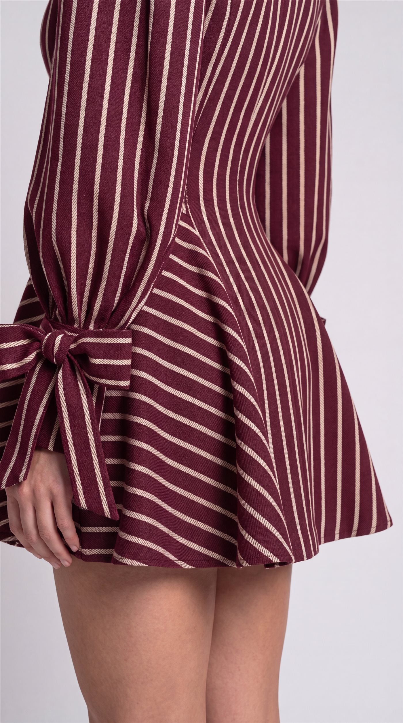 Zarrelah campaign — striped skirt and bow cuff detail