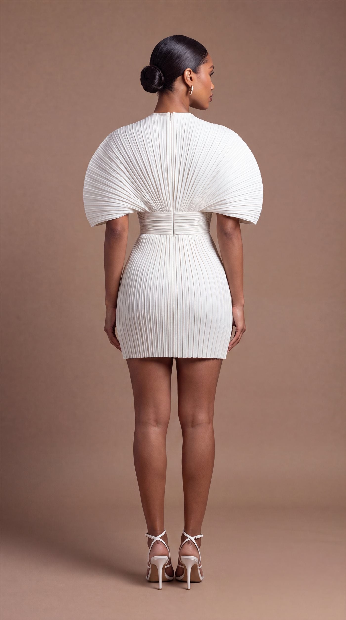 Zarrelah campaign — ivory pleated dress, back view